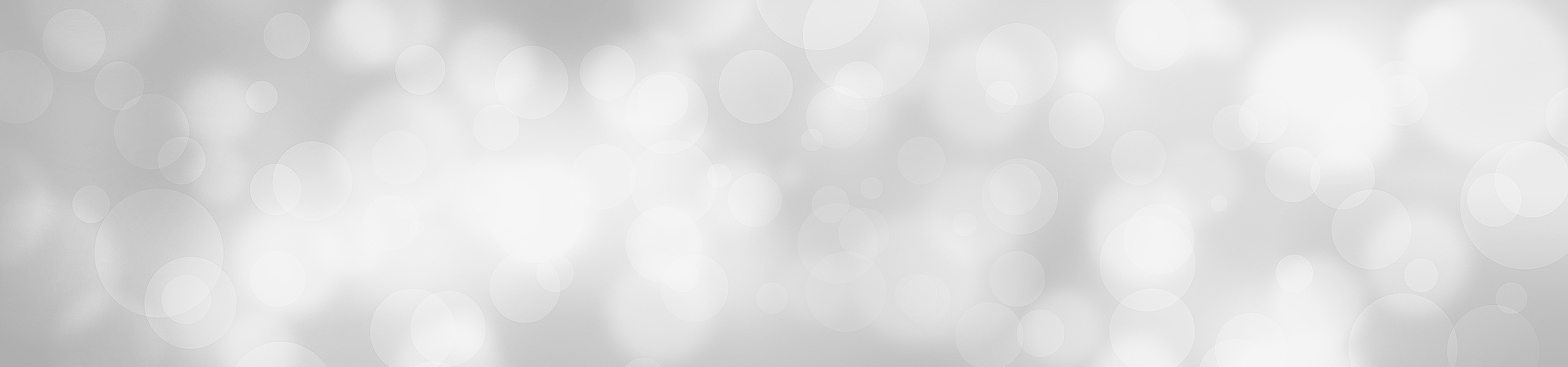 Soft blurred light bokeh background in white and gray tones, calm and understated mood