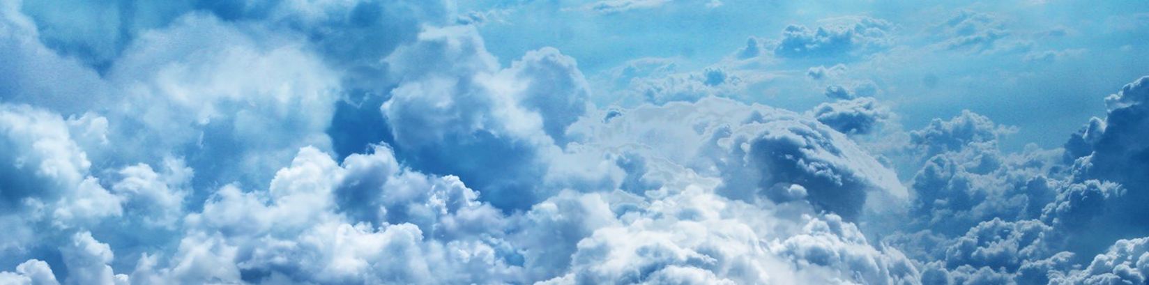Aerial view of dense white and blue clouds, airy and serene mood